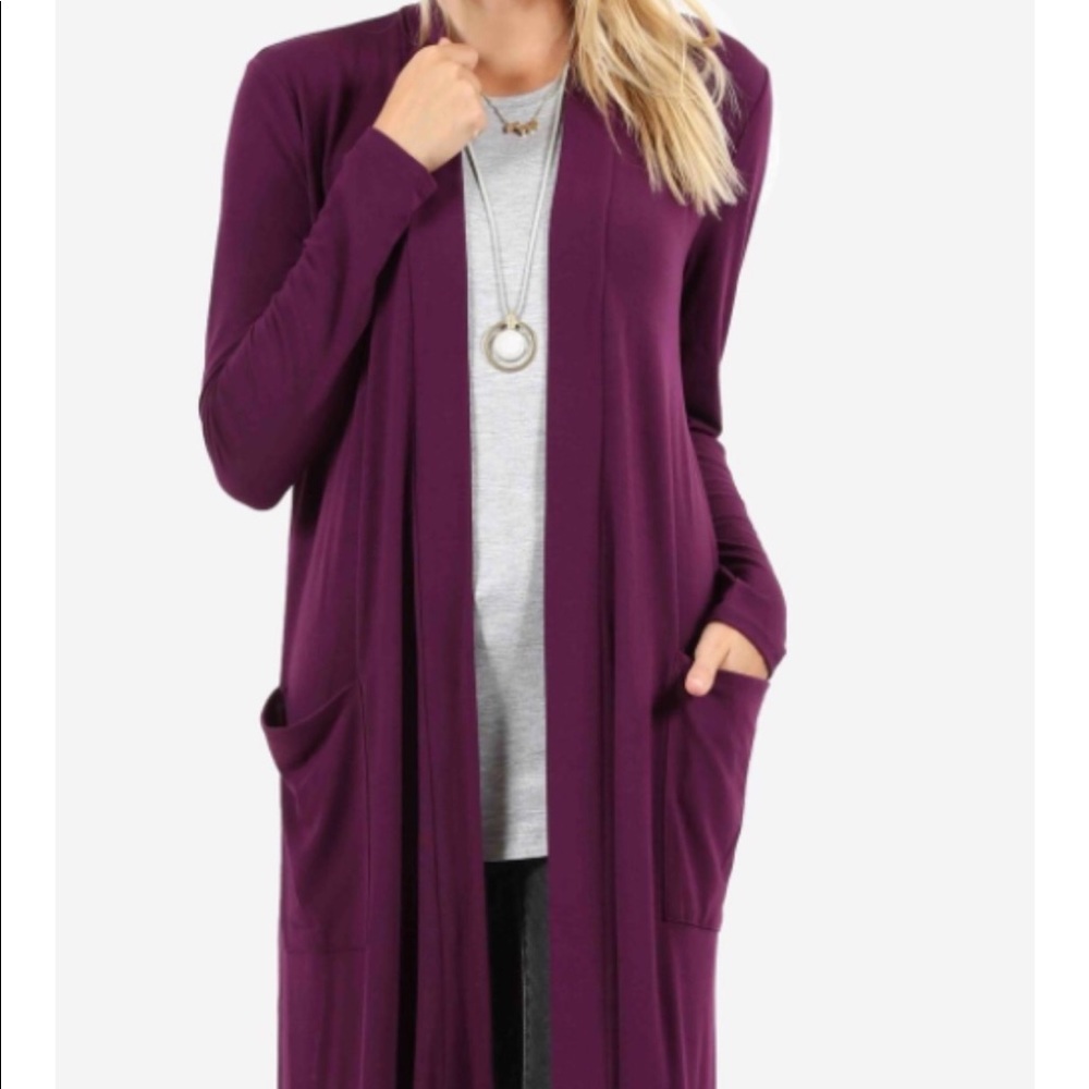 Women’s sweater long goes down to feet.